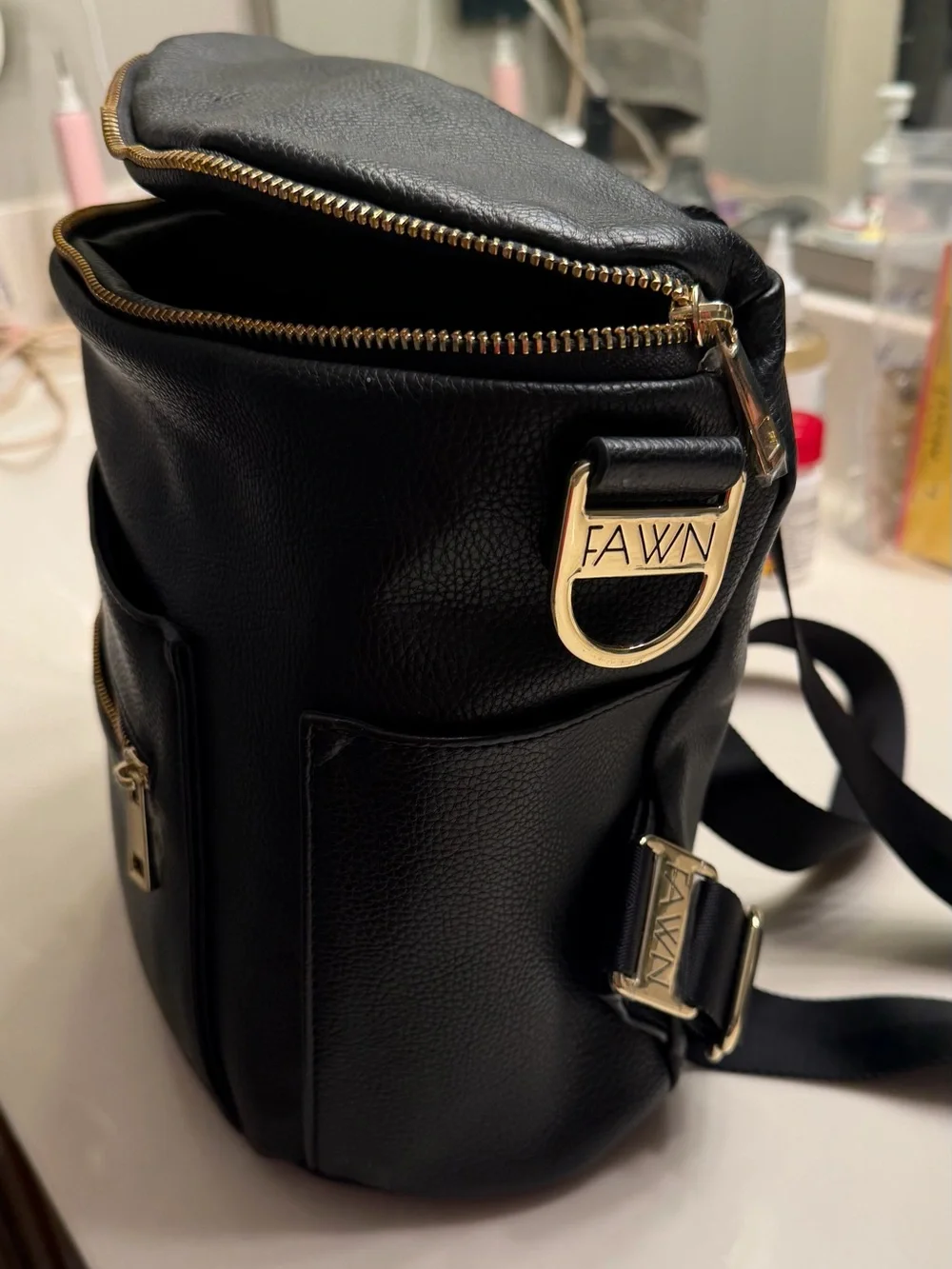 FAWN DESIGN Black Pebbled Leather Crossbody Backpack with Gold Hardware